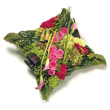 An image of the Contemporary Cushion-Shaped Flower Arrangement, showcasing a modern design with a blend of roses, calla lilies, and vibrant blooms