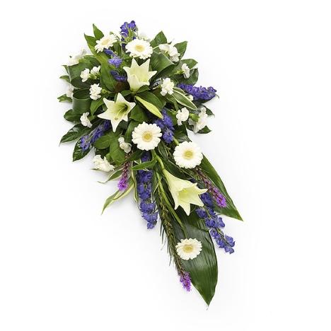 An image of the Purple and White Single Ended Spray arrangement, showcasing a harmonious fusion of purple and white blooms, including lilies, carnations, and gerbera daisies, creating a beautiful and thoughtful tribute.