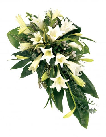 An image of the White Lily Single Ended Spray arrangement, featuring a striking arrangement of classic white lilies that radiate elegance and serenity, forming a beautiful and fragrant tribute